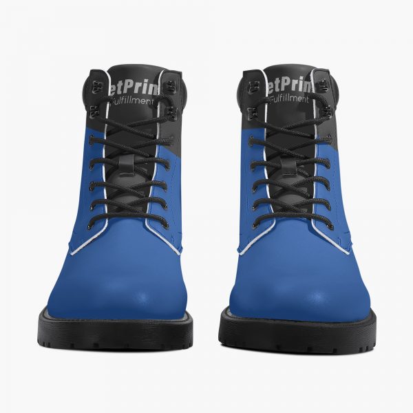 A pair of blue and black men's mid-boots with a logo