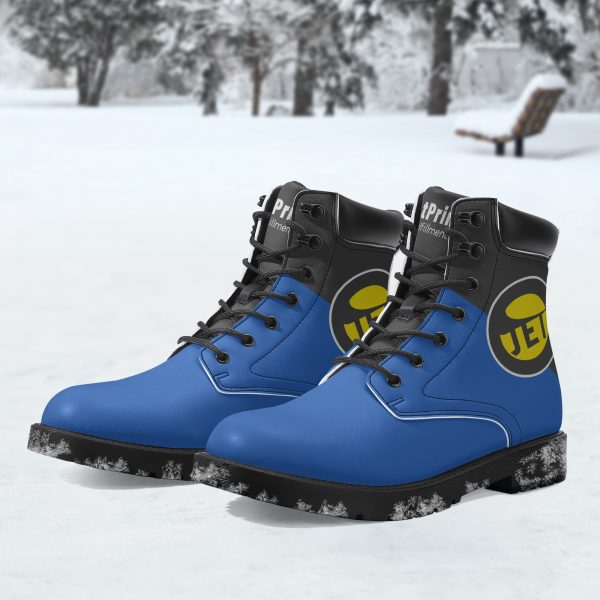 A pair of blue and black men's mid-boots with a logo can be found in the snow.