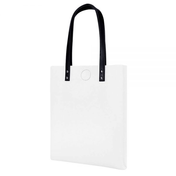 A white tote bag is placed on the side