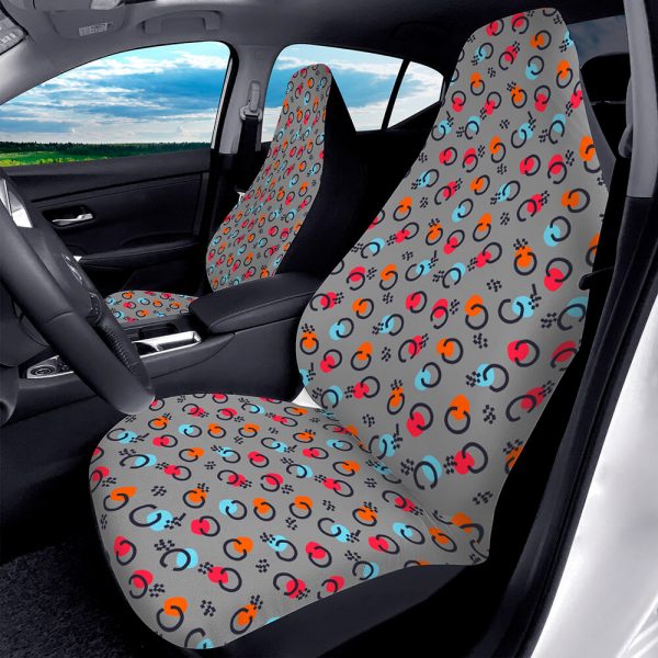 The front seats of the car have patterned seat covers.