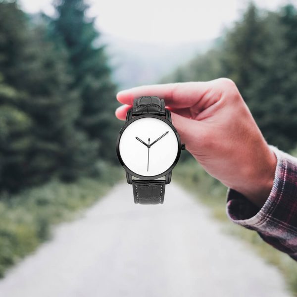 A male hand holds a quartz watch