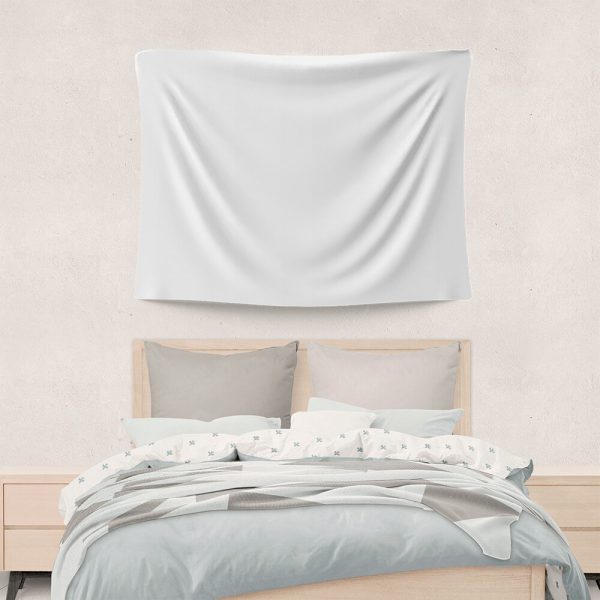 A pure white tapestry hangs on the wall, and there is a bed beneath it.