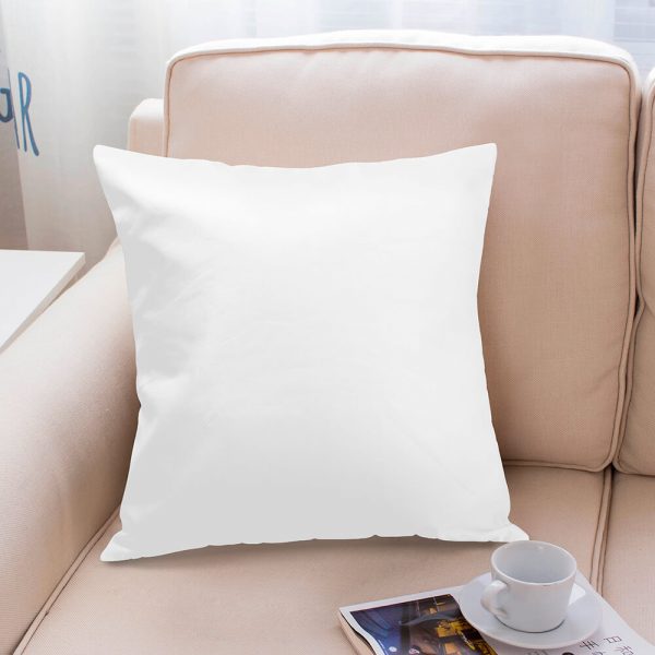 A pure white pillow is placed on the sofa