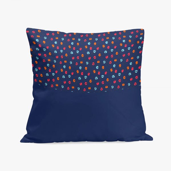 a pillow in dark blue with a pattern on the top half