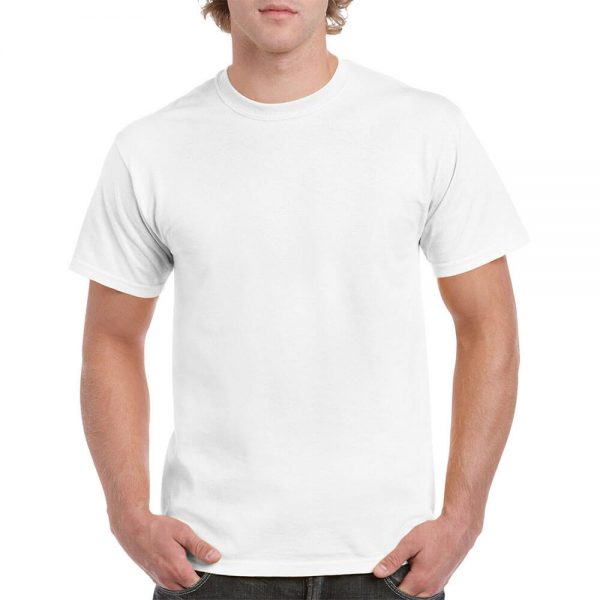 The man is dressed in soft white cotton t-shirts and poses with his hands in his pockets.