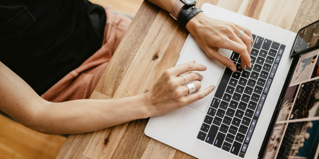 A woman is working on a computer