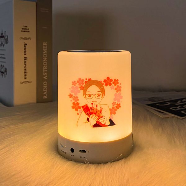 A girl is printed on the bluetooth night light speaker