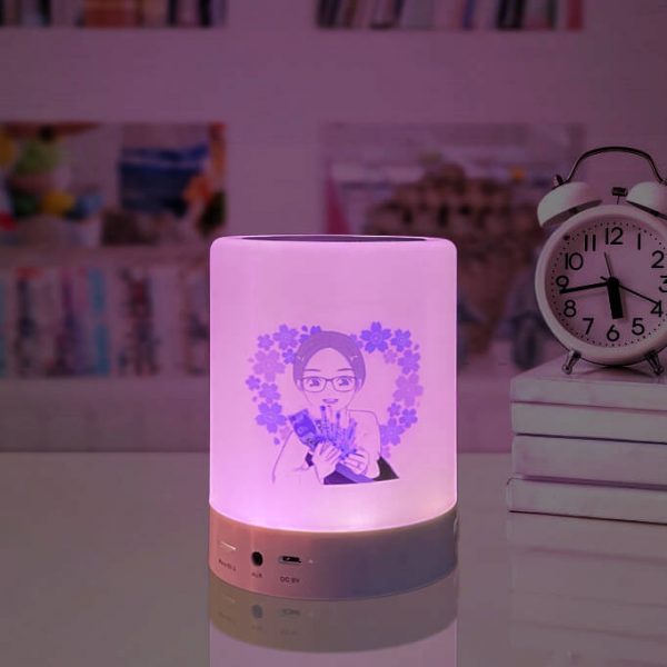 A girl is printed on the bluetooth night light speaker