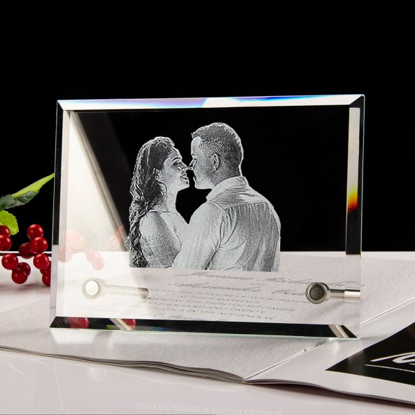 A photo of a couple is customised in a crystal photo frame