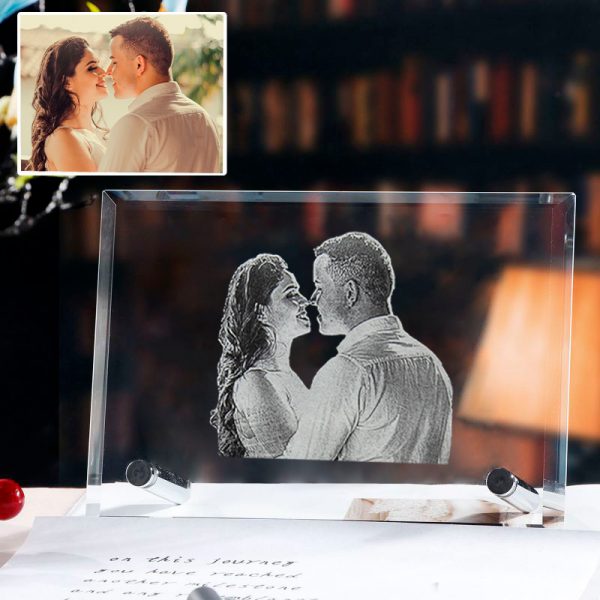 A photo of a couple is customised in a crystal photo frame