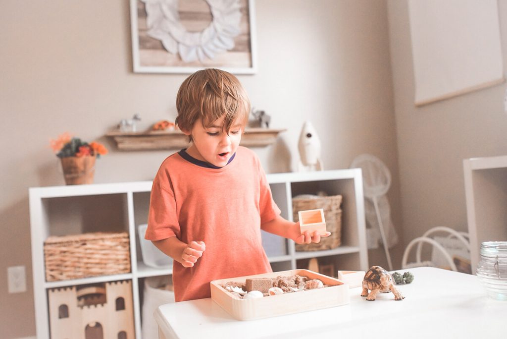 A little boy is making a gift