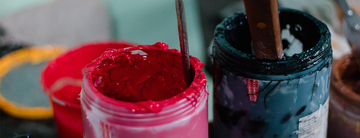 a bottle of red paint