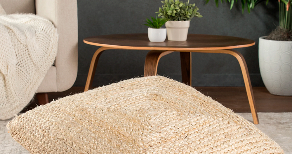 floor cushions are placed beside the coffee table