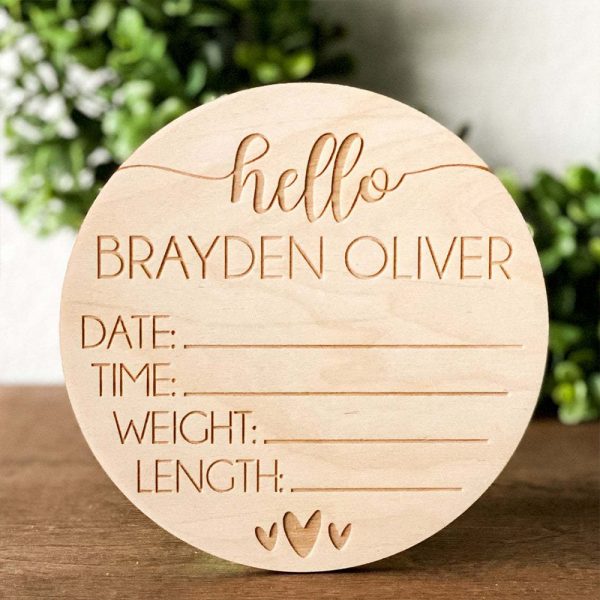 A wooden newborn sign