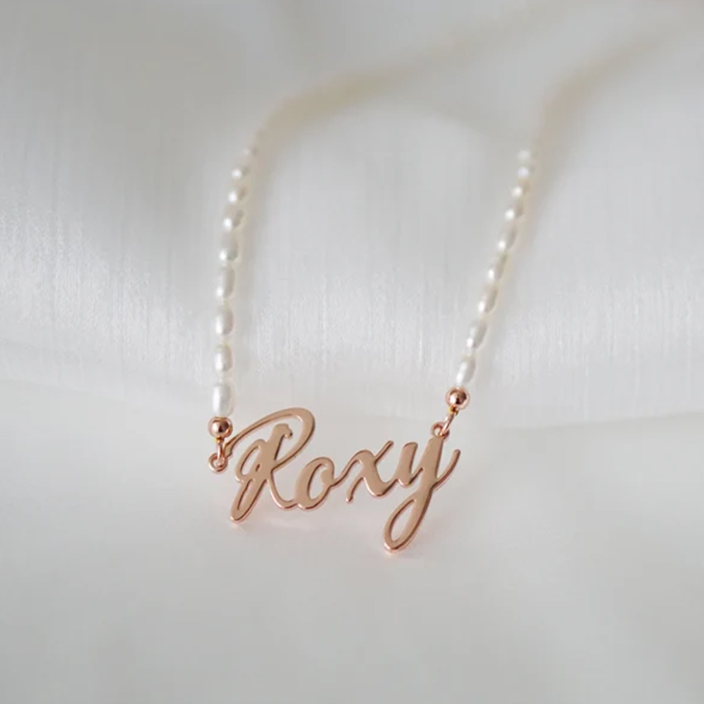 A pearl necklace with engraved name