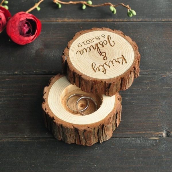 A customizable round wooden wedding ring box