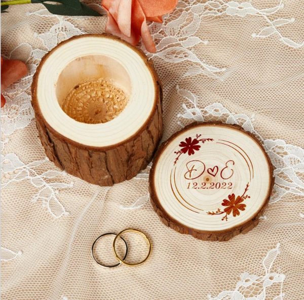 A customizable round wooden wedding ring box