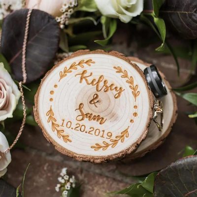 A customizable round wooden wedding ring box