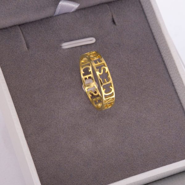 a gold ring with Roman numerals