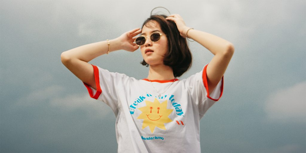 A female model wears an AOP cotton t-shirt