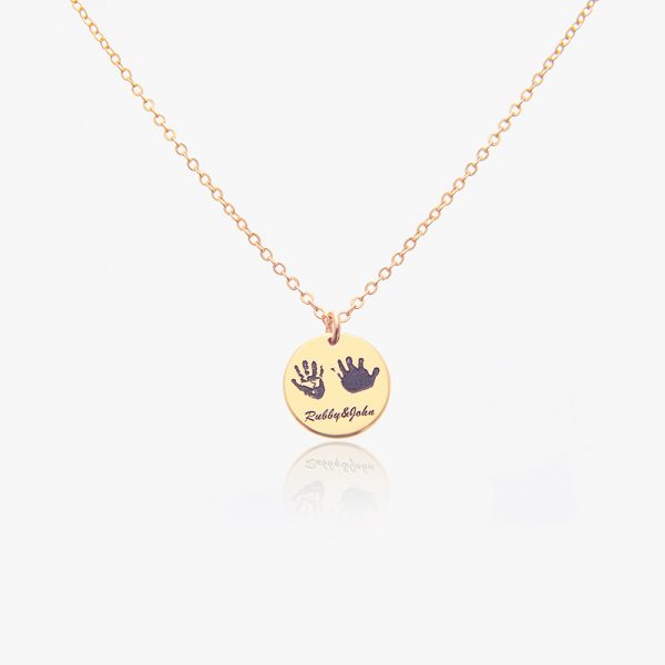 A golden handprint necklace