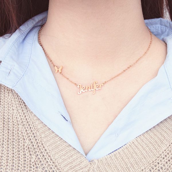 A female model wears a gold necklace with a customizable name