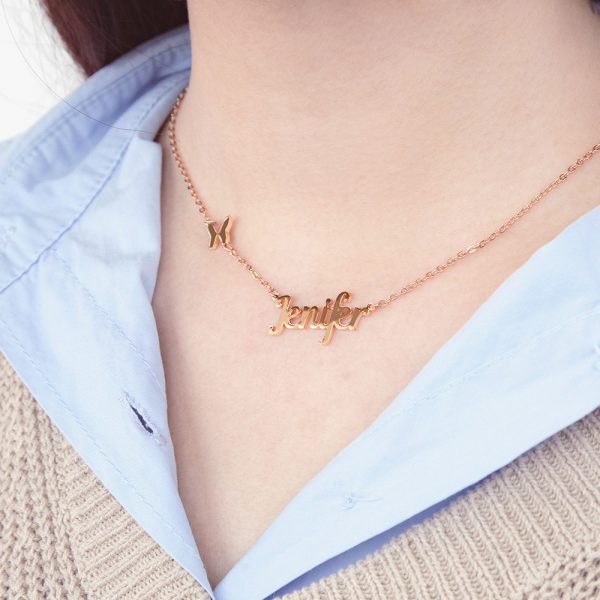 A female model wears a gold necklace with a customizable name