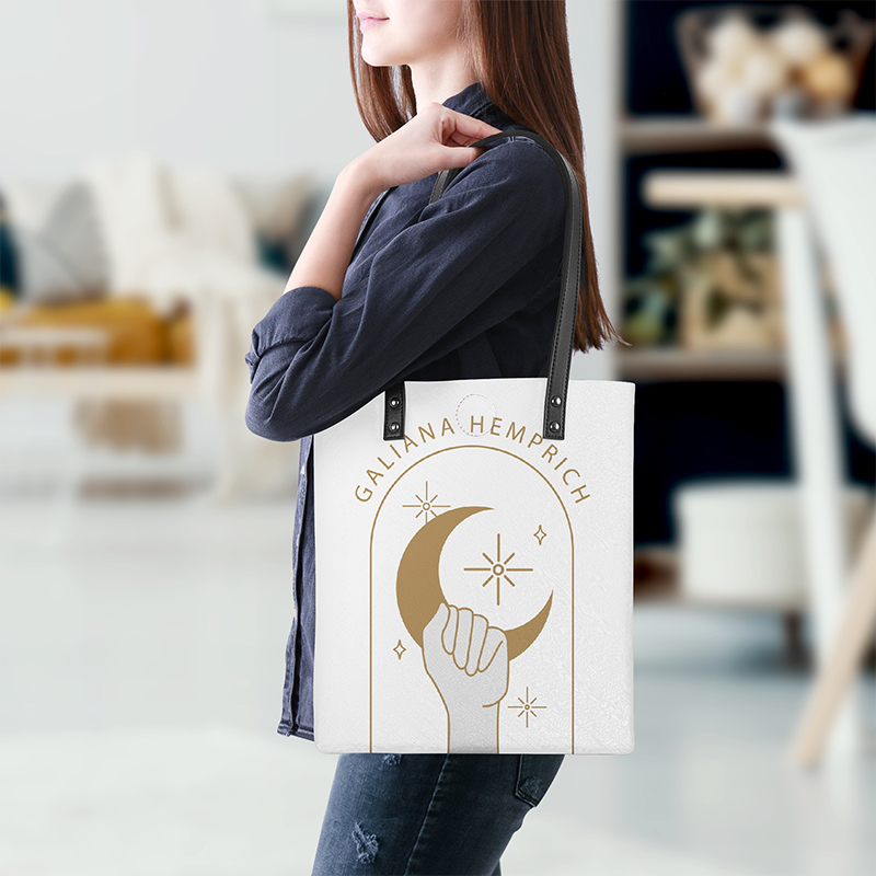 A female model is carrying a PU leather tote bag