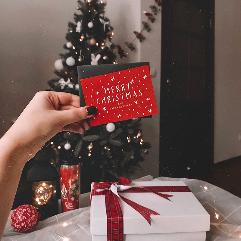 A person holds a Christmas card