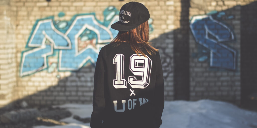 A woman wearing a sporty black hoodie