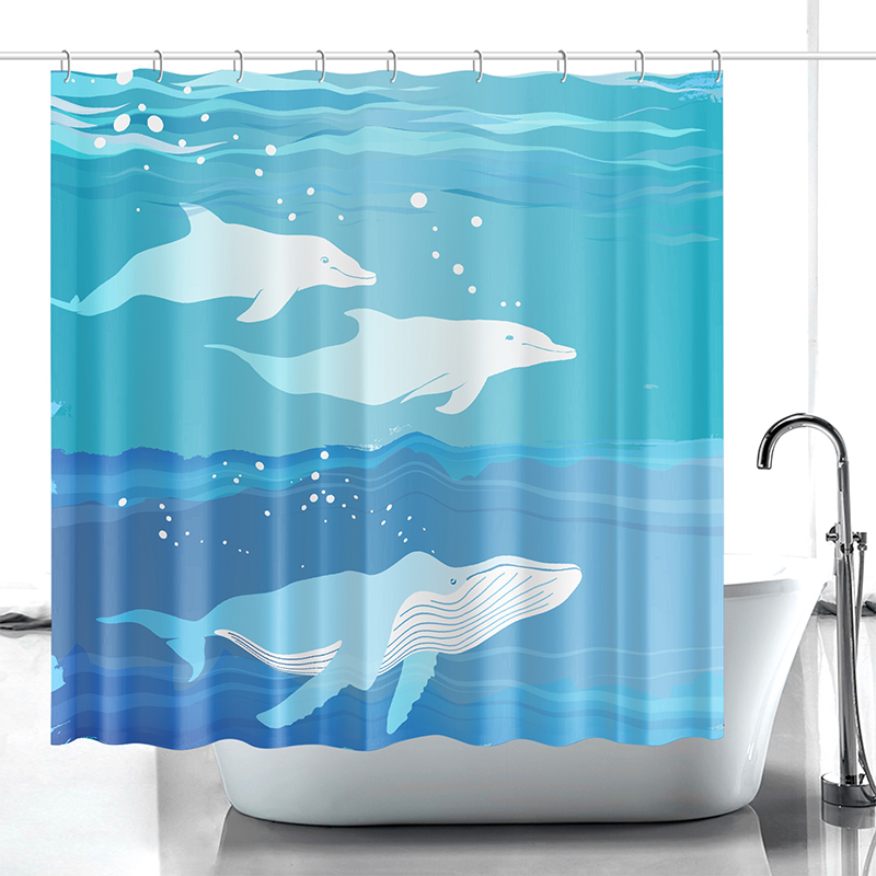 A blue shower curtain with dolphins