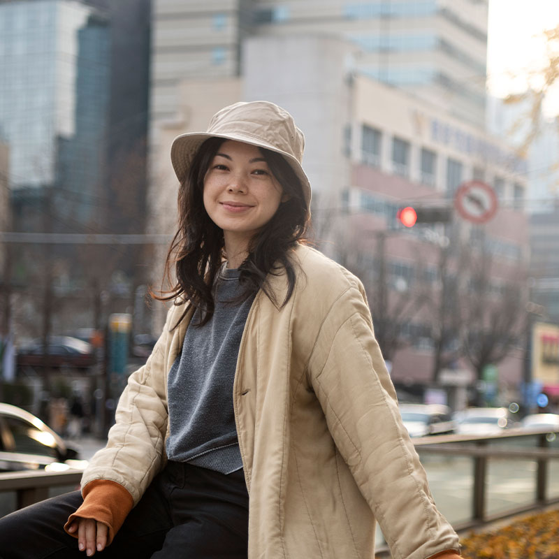 A woman wearing a brown boonie hat