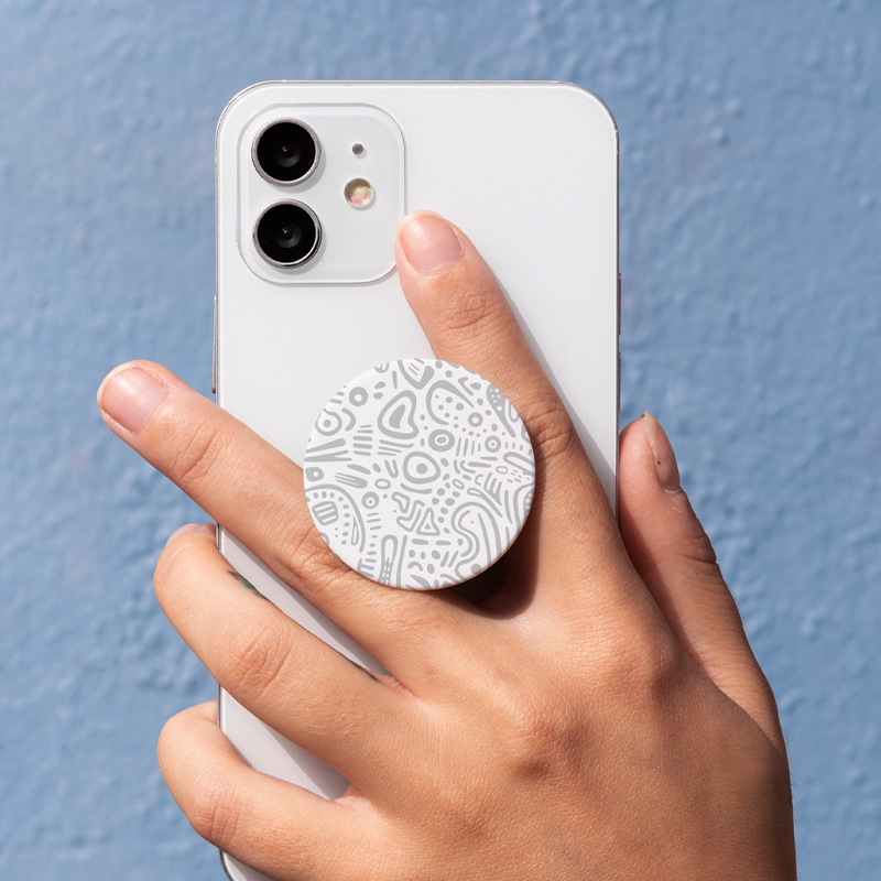 A white abstract style mobile phone case is picked up