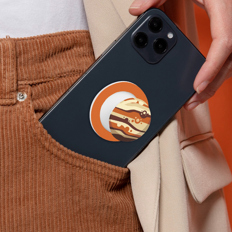 A cartoon style mobile phone case is picked up from the pocket