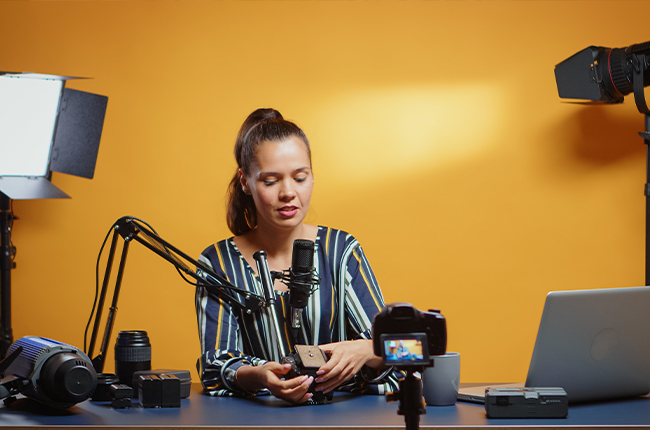 A female YouTuber is recording a video