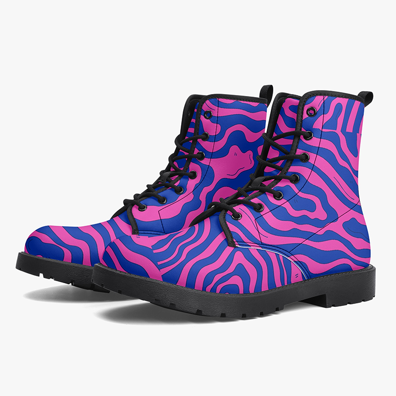 A pair of purple boots with an abstract pattern