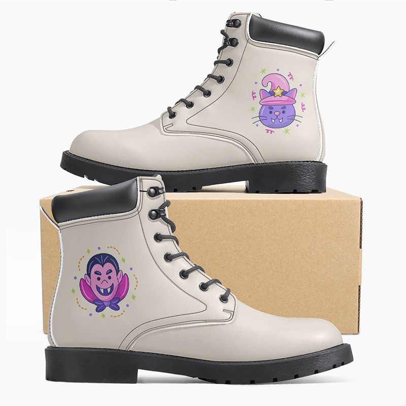 A pair of beige boots with cartoon characters