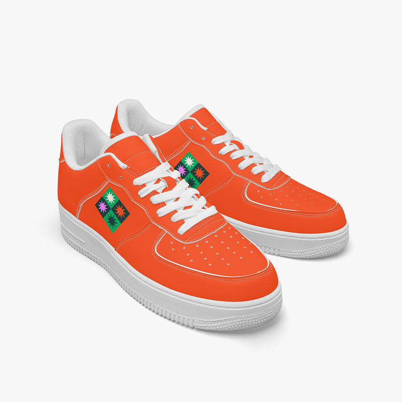 A pair of orange sneakers with the brand's logo