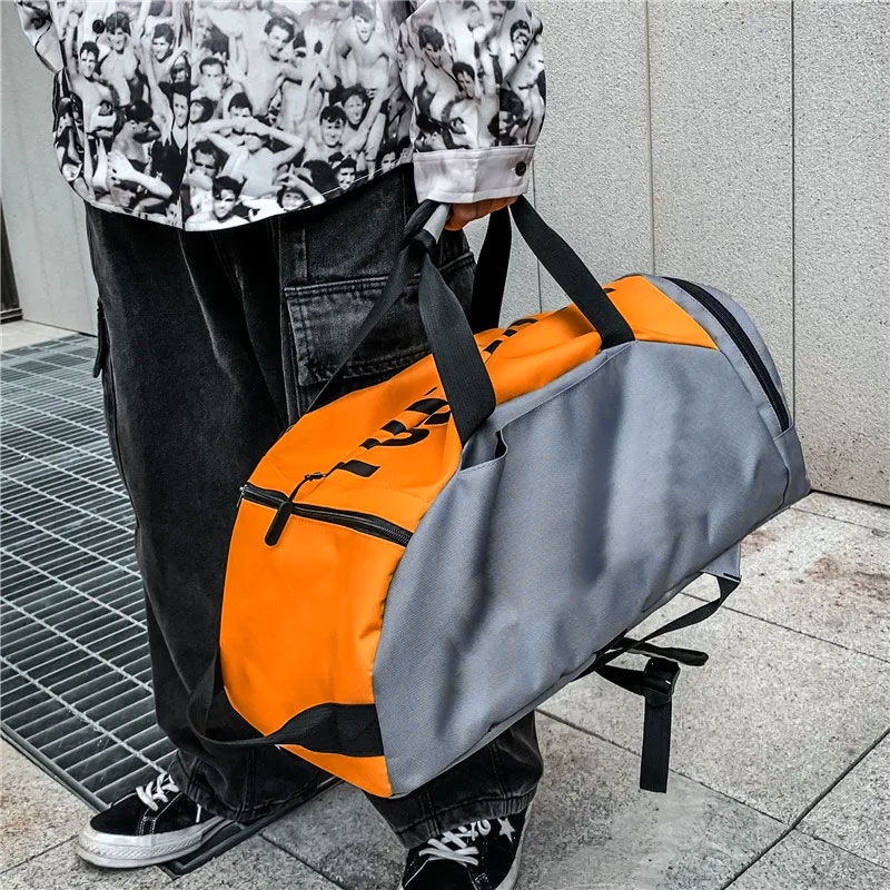 A man holding a duffel bag