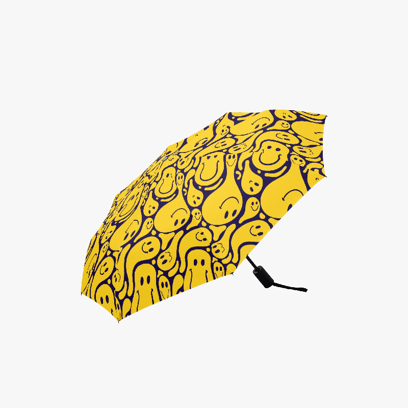 Yellow umbrella with funny cartoon pattern