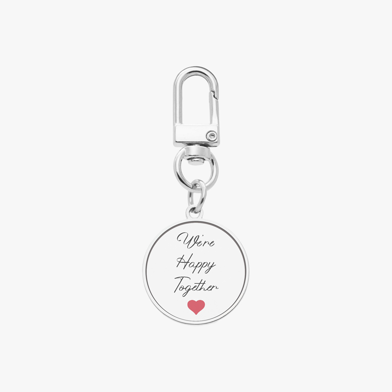 A keychain with a personalized message and a heart