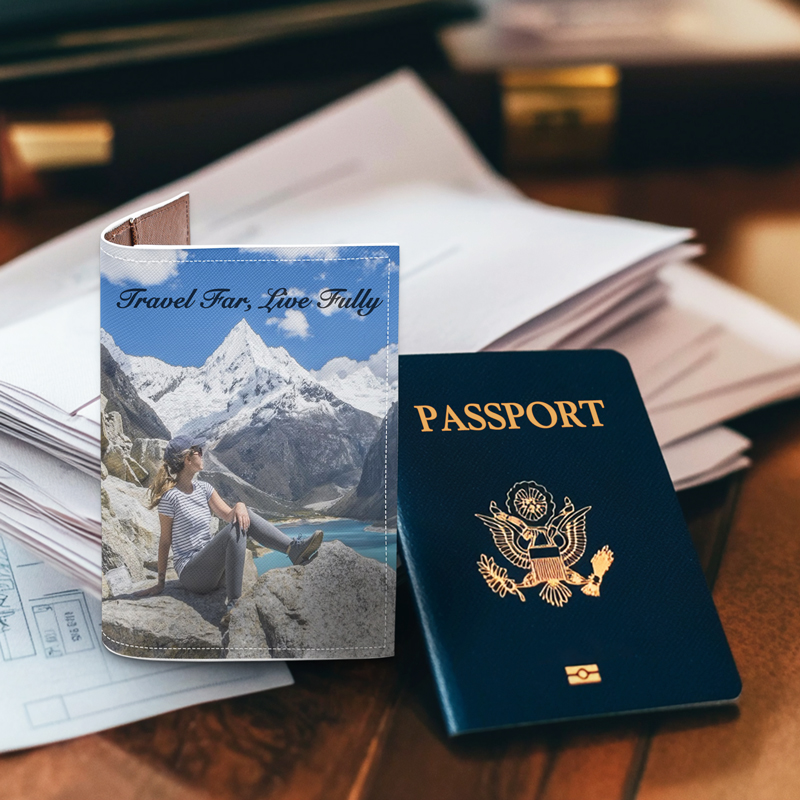 A passport cover with a travel photo is placed on the table