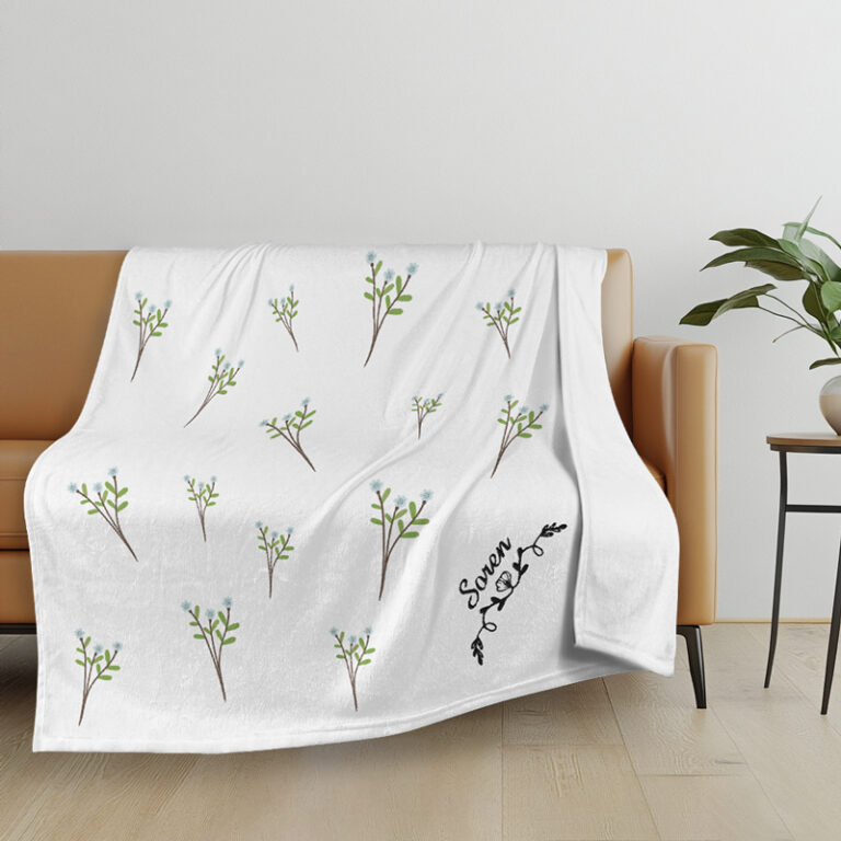 Embroidered blanket with a name and floral motif