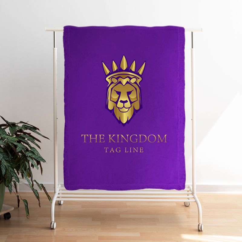 A purple blanket with a logo is hung on a hanger