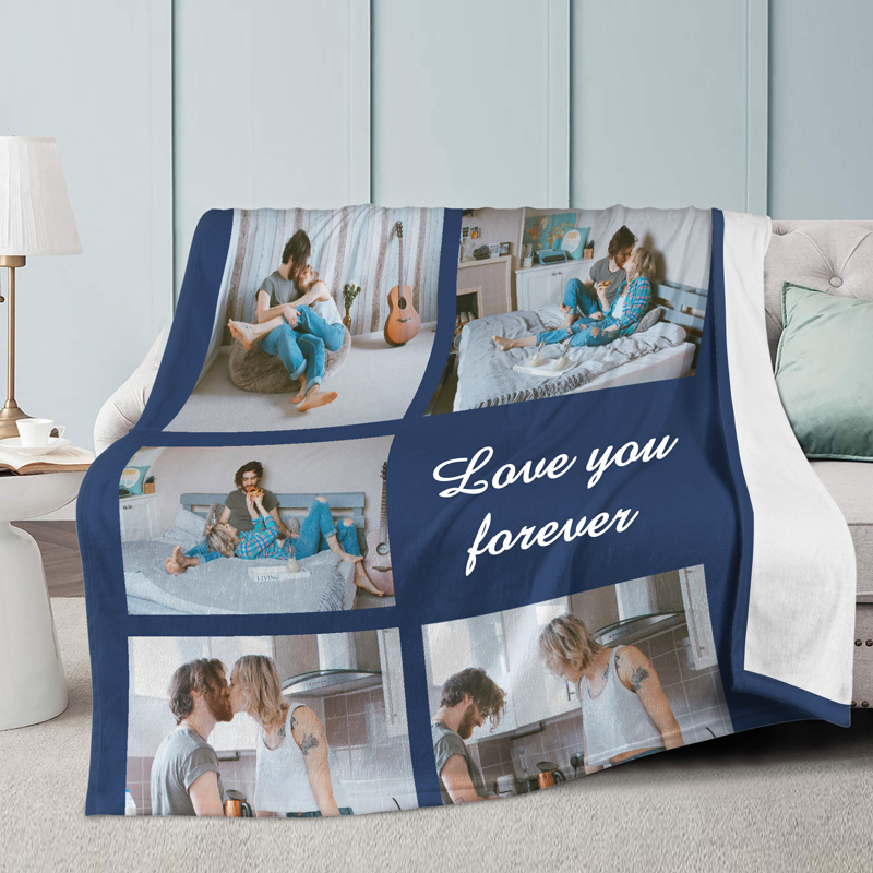 A blue blanket with a picture on it is placed on the sofa