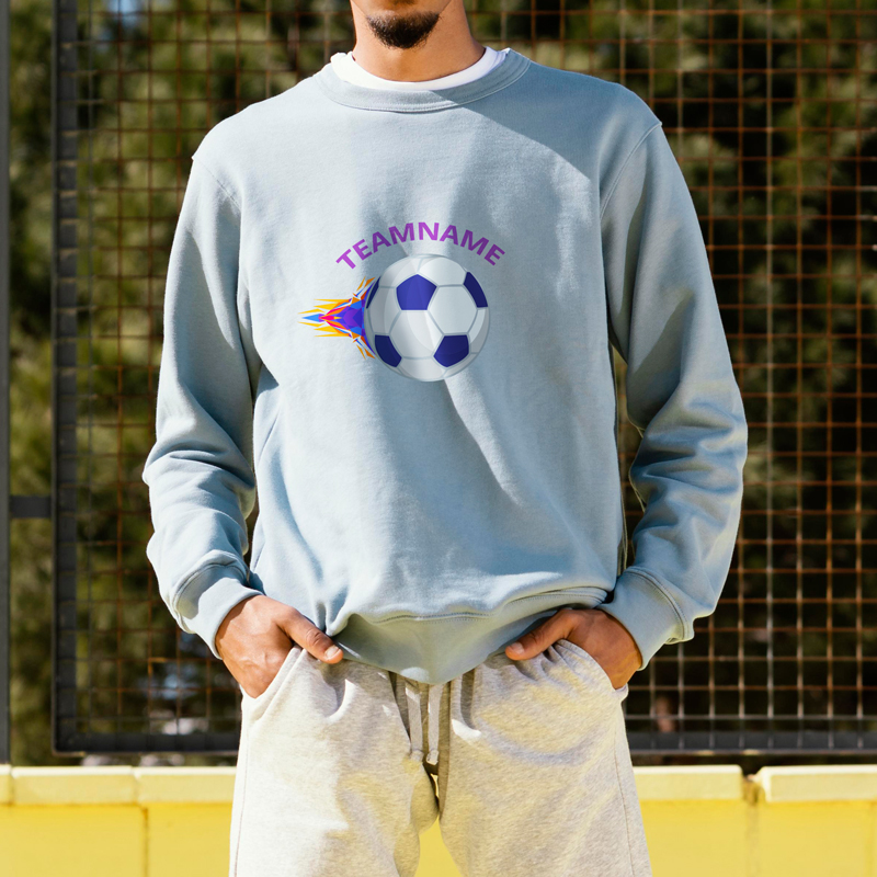 A man wearing a gray sweatshirt with a football pattern