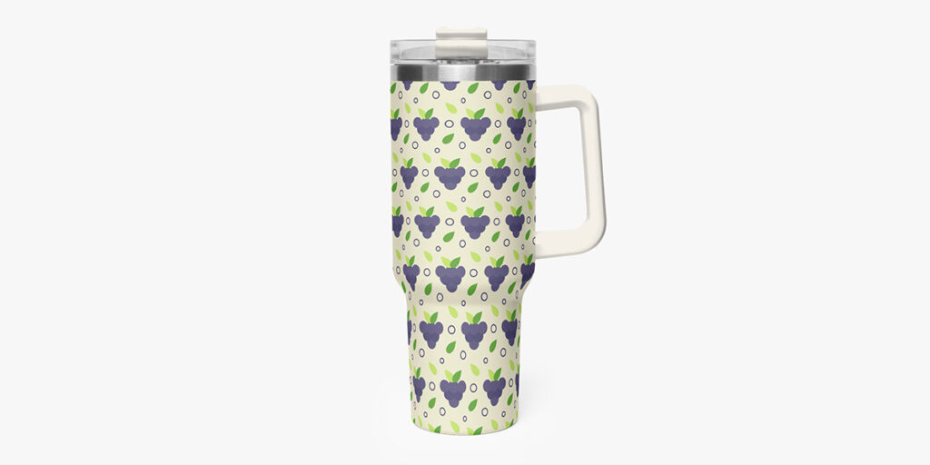 A tumbler with a grape design